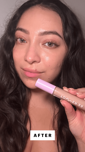 Allure commerce editor Madison San Miguel applying the Tower 28 Beauty Swipe Serum Concealer